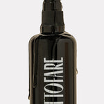 Tuttofare Cleansing Oil black bottle with oil dripping down the side