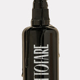 Tuttofare Cleansing Oil black bottle with oil dripping down the side