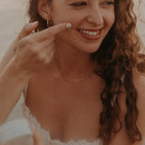 Woman applying Tuttofare Roman Blue Tallow Balm