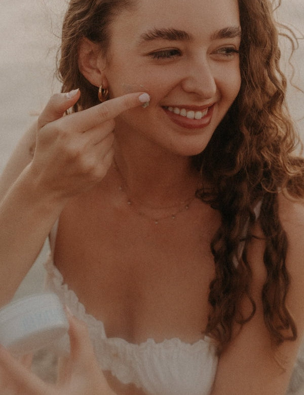 Woman applying Tuttofare Roman Blue Tallow Balm