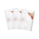 Three white Vanessa Megan Copper & Vitamin C Illuminating Sheet Mask sachets fanned out, each with copper-coloured lettering and a metallic corner design.