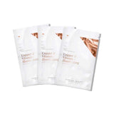 Three white Vanessa Megan Copper & Vitamin C Illuminating Sheet Mask sachets fanned out, each with copper-coloured lettering and a metallic corner design.