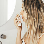 Model applying Vanessa Megan Liliquoi Natural Perfume