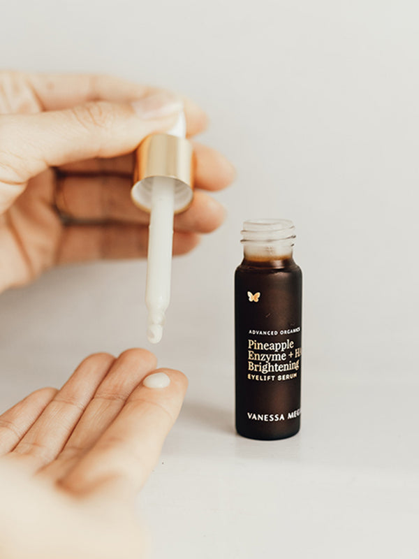 Dropper of Vanessa Megan Pineapple Enzyme Brightening Eyelift Serum in hand