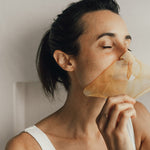 Model wearing Vanessa Megan Gold and Lime Caviar Sheet Mask