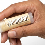 Hand holding Hurraw! Organic Lip Balm - Vanilla Bean 4.8g