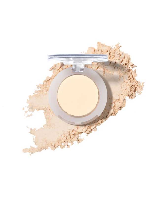 The 100% Pure Fruit Pigmented® Eye Shadow 2g by 100% Pure, with its lid open, rests on a white background as loose powder spreads around it in a graceful sweep.