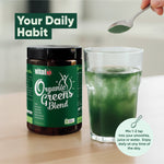 Vital Organic Greens Blend beside a prepared green drink