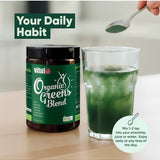Vital Organic Greens Blend beside a prepared green drink