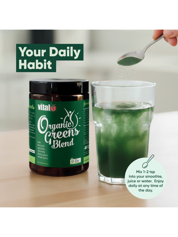 Vital Organic Greens Blend beside a prepared green drink