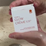 Hands holding Vitamin C Glow Creme packaging – Thrive Tallow Vitamin C Glow Creme 100ml