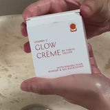 Hands holding Vitamin C Glow Creme packaging – Thrive Tallow Vitamin C Glow Creme 100ml