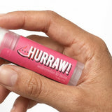 Hand holding Hurraw! Organic Lip Balm - Watermelon 4.8g