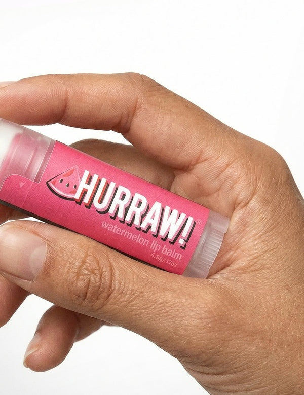 Hand holding Hurraw! Organic Lip Balm - Watermelon 4.8g