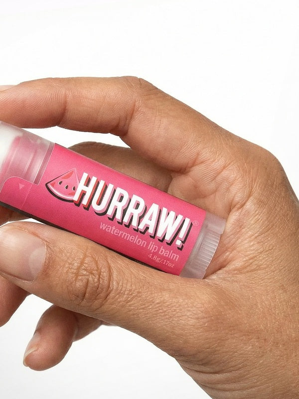 Hand holding Hurraw! Organic Lip Balm - Watermelon 4.8g