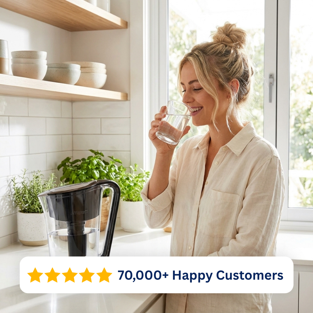 Woman drinking filtered water beside the Waters Co MyWaterJug