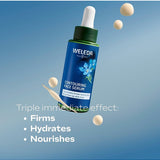 Weleda Contouring Face Serum bottle on a blue background with serum droplets and text reading Triple immediate effect: firms, hydrates and nourishes.