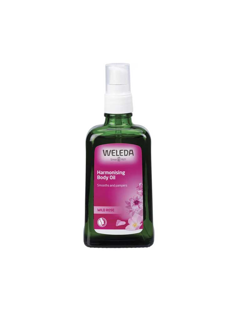 Weleda Harmonising Body Oil Wild Rose in a green bottle with a delicate Damask Rose scent for all skin types.