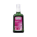 Weleda Harmonising Body Oil Wild Rose in a green bottle with a delicate Damask Rose scent for all skin types.