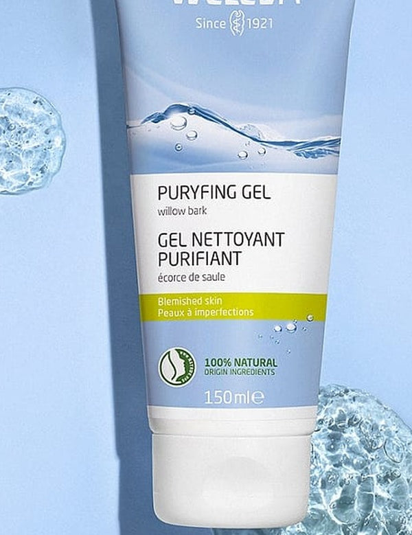 Weleda Purifying Gel Cleanser tube displayed against a pale blue background with clear water-like bubbles.