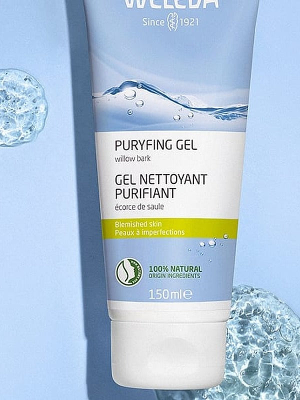 Weleda Purifying Gel Cleanser tube displayed against a pale blue background with clear water-like bubbles.
