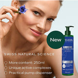 A woman holds a small blue flower beside her eye next to a large image of Weleda Revitalising Serum Body Lotion, with text highlighting the 250ml size, active complexes and pump dispenser.