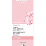 Front of the pink Weleda Sensitive Gentle Milk Cleanser 75ml carton with almond blossom artwork and product details.