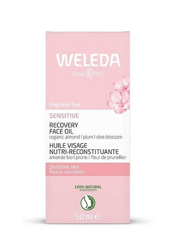 Pale pink carton of Weleda Sensitive Recovery Face Oil 50ml with blossom illustrations, product details and natural certification mark visible.