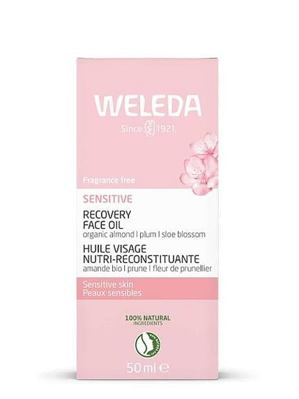 Pale pink carton of Weleda Sensitive Recovery Face Oil 50ml with blossom illustrations, product details and natural certification mark visible.