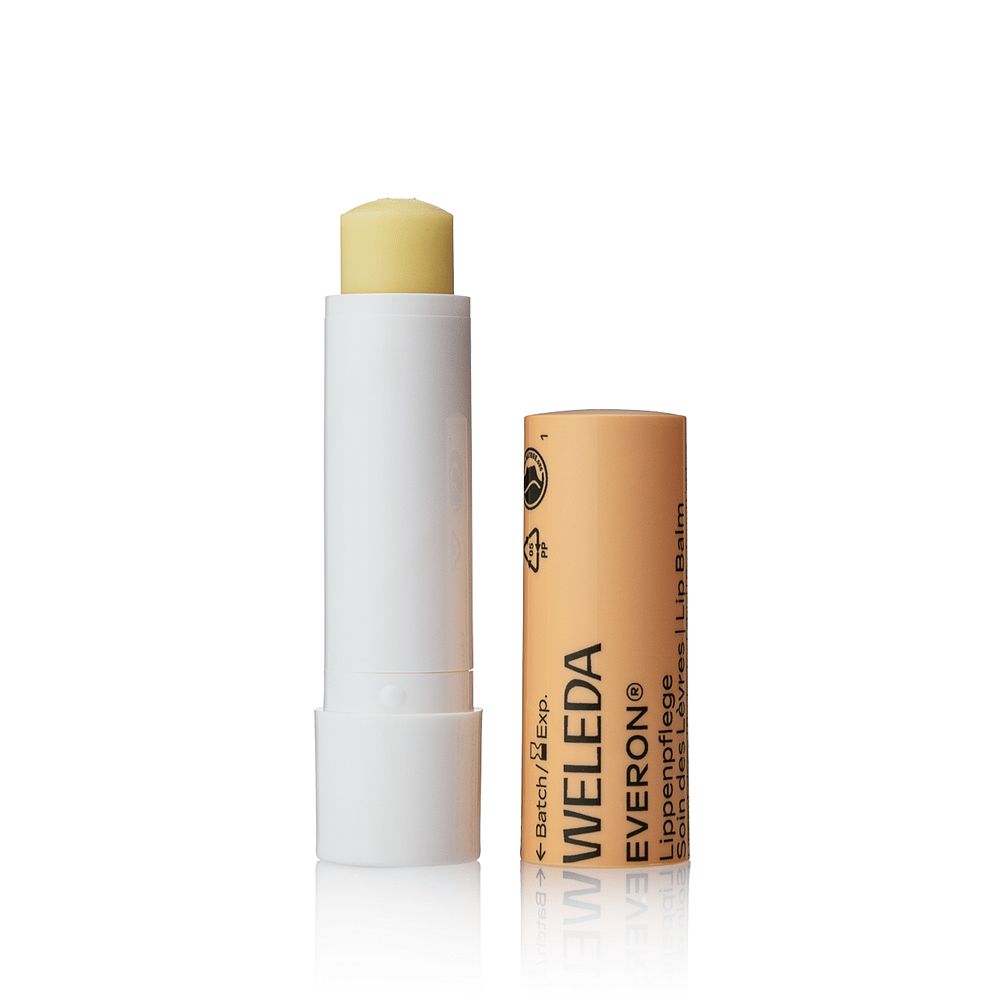 Open Weleda Everon Lip Balm with the cap removed
