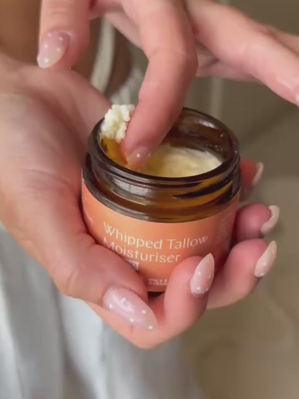 Hand taking Whipped Tallow Moisturiser from the jar – Thrive Tallow Whipped Tallow Moisturiser Scented 70ml