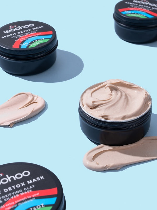 WooHoo Armpit Detox Mask tins styled with swatches of the creamy clay texture