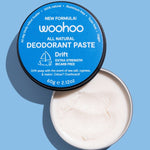 Open WooHoo Drift deodorant paste showing its creamy texture on a blue background
