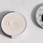 Open WooHoo Tux deodorant paste showing its creamy texture