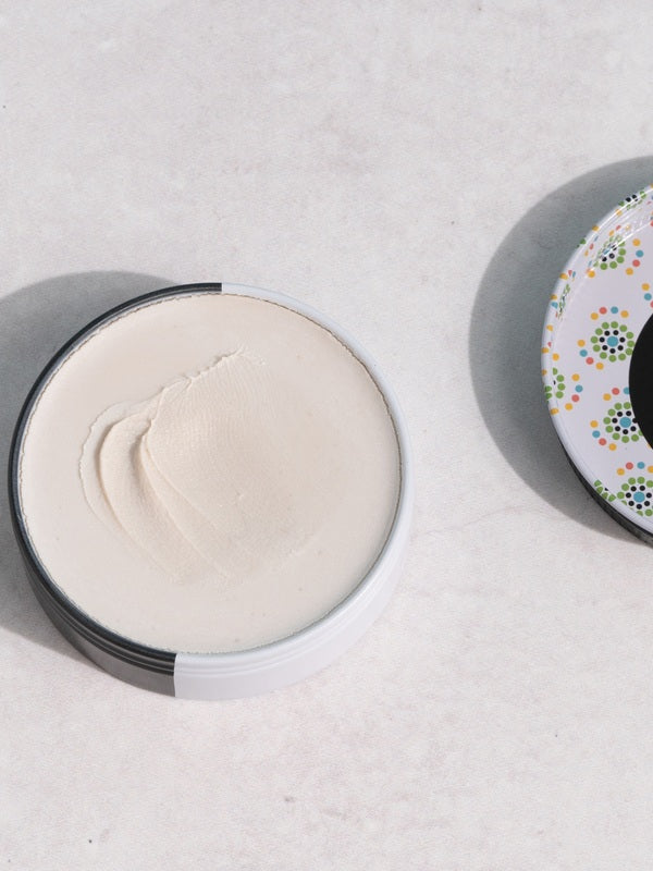 Open WooHoo Tux deodorant paste showing its creamy texture