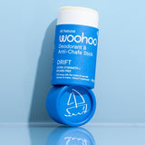 WooHoo Drift deodorant stick styled open on a reflective blue surface