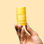 WooHoo Mellow sensitive deodorant stick held in a hand