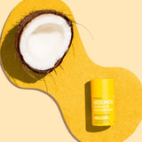 WooHoo Mellow deodorant stick styled with coconut on a yellow background