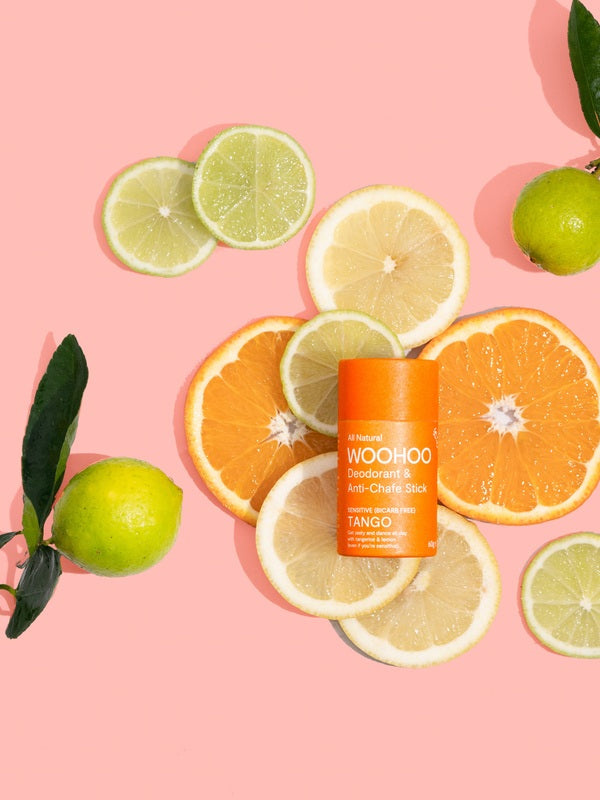 WooHoo Tango deodorant stick surrounded by fresh citrus slices