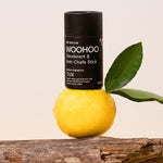 WooHoo Tux deodorant stick balanced on lemon and eucalyptus branches