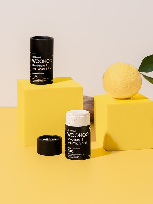 WooHoo Tux deodorant sticks styled with lemon on yellow blocks