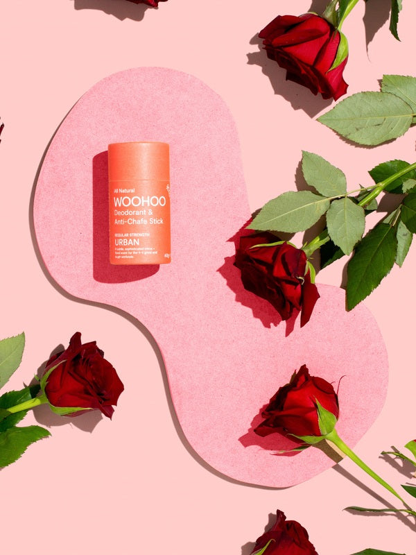 WooHoo Urban deodorant stick styled among red roses