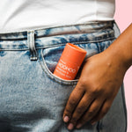 WooHoo Urban deodorant stick tucked into a jeans pocket