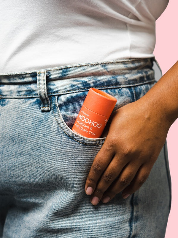 WooHoo Urban deodorant stick tucked into a jeans pocket