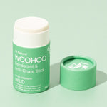 Open WooHoo Wild deodorant stick styled on a green background