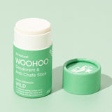 Open WooHoo Wild deodorant stick styled on a green background