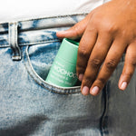 WooHoo Wild deodorant stick tucked into a jeans pocket