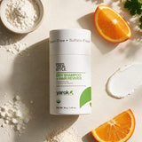 Yarok Feed Your Style Dry Shampoo flat lay with orange and powder