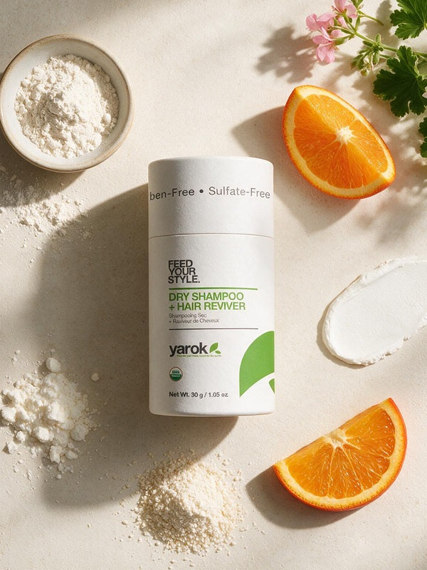 Yarok Feed Your Style Dry Shampoo flat lay with orange and powder