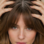 Woman massaging Yarok Feed Your Style Dry Shampoo into her scalp